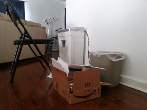 My summertime workstation: Shredding my sister's old mail.